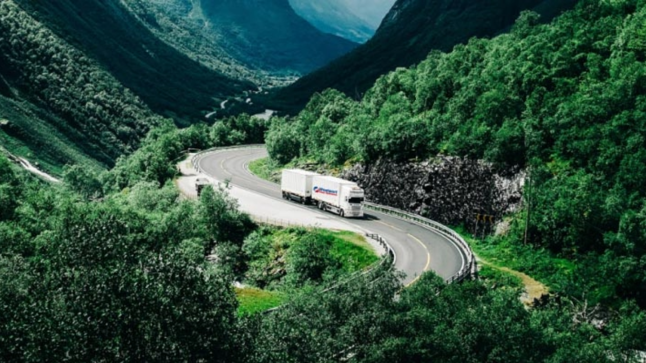 Wesport branded truck driving along a hillside road