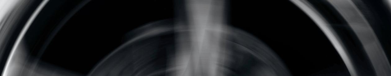 A black and white graphic image of an automotive part which appears to be spinning