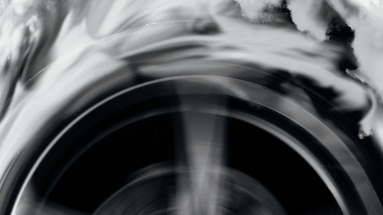 A black and white graphic image of an automotive part which appears to be spinning