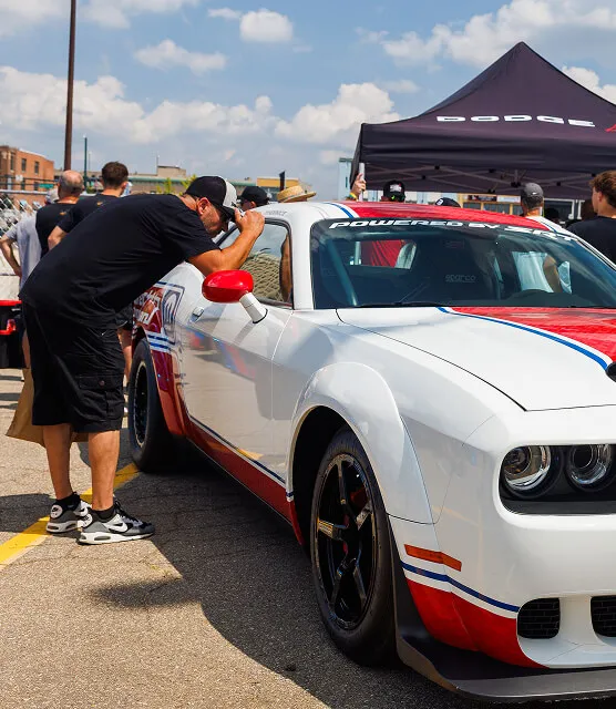 enthusiast-looks-into-direct-connection-car-window