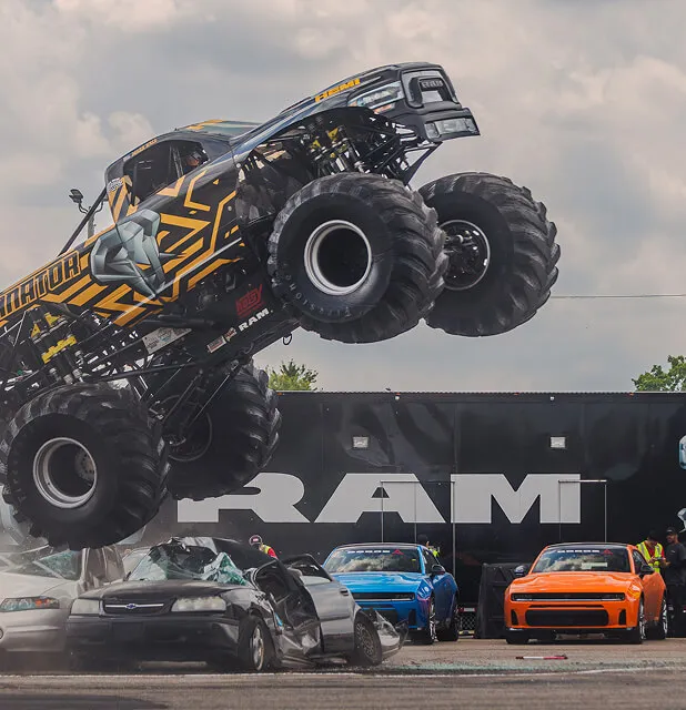 ram-monster-truck-jumping-car