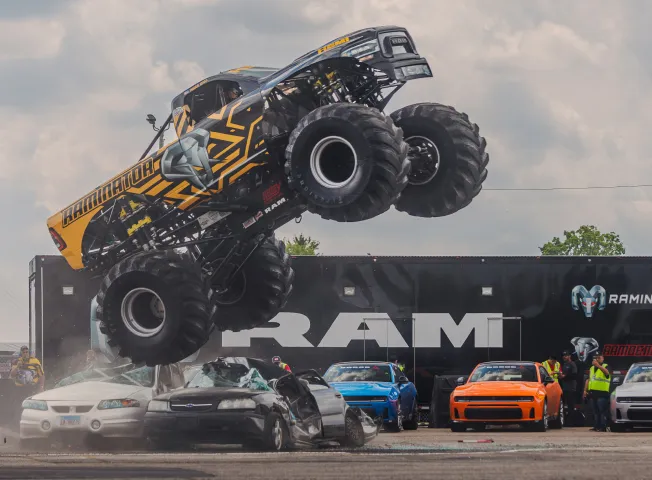 ram-monster-truck-jumping-car