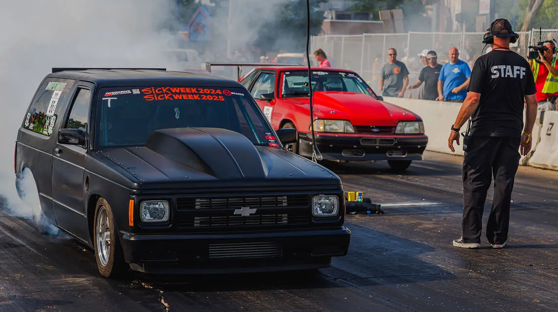 two-cars-warm-tires-at-starting-line