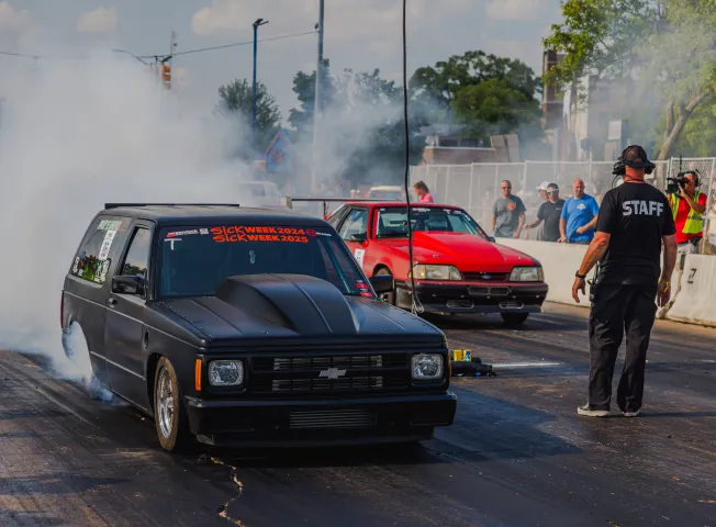 two-cars-warm-tires-at-starting-line
